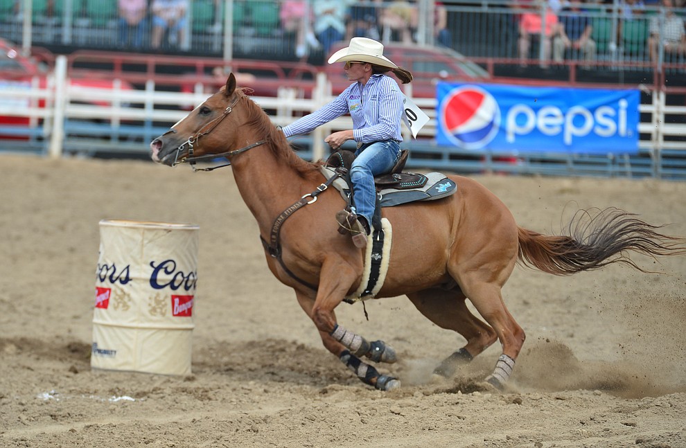 Ericka Nelson has a 17.43 second run in the barrel racing during the final performance of the Prescott Frontier Days Rodeo Sunday July 7, 2019. (Les Stukenberg/Courier)