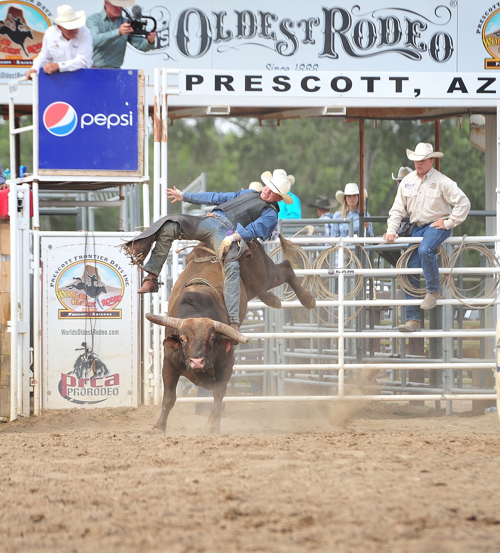 Joseph McConnel scores 85 on Monte Walsh in the bull riding during the final performance of the Prescott Frontier Days Rodeo Sunday July 7, 2019. (Les Stukenberg/Courier)