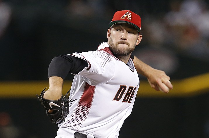 Arizona Diamondbacks pitcher Alex Young throws against the Colorado Rockies in the first inning of a baseball game, Sunday, July 7, 2019, in Phoenix. (Rick Scuteri/AP)