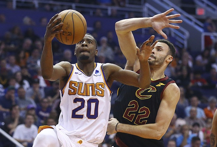 Josh Jackson (20) drives past Cleveland Cavaliers forward Larry Nance Jr. (22) during the second half April 1, 2019, in Phoenix. The Suns have traded Jackson to Memphis. (Ross D. Franklin/AP, file)