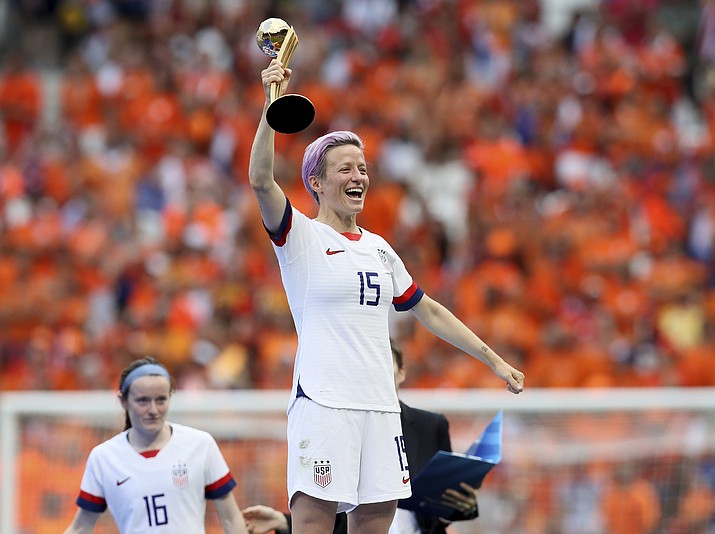 United States' Megan Rapinoe celebrates her team's victory with the trophy after the Women's World Cup final soccer match between US and The Netherlands at the Stade de Lyon in Decines, outside Lyon, France, Sunday, July 7, 2019. US won 2:0. (David Vincent/AP)