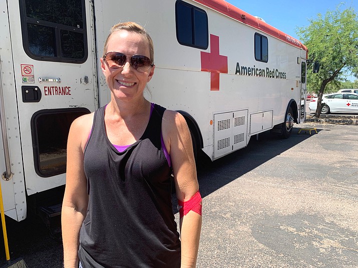 Karen Robinson volunteered for the American Red Cross in high school because she was ineligible to donate blood, but this week the Chandler mom was proud to give blood to support her daughter’s friend, who has been affected by the summer shortage. (Photo by Amanda Slee/Cronkite News)