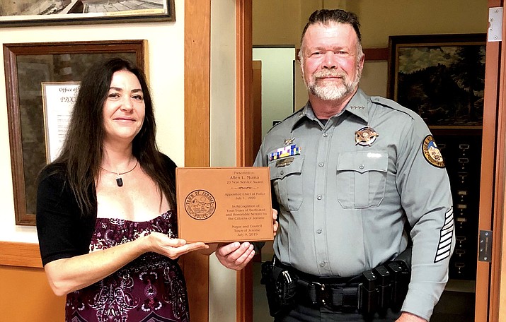 Jerome Police Chief Allen Muma, who recently completed his 20th year of service to the Town of Jerome, was presented with a commemorative plaque from Mayor Alex Barber. Town of Jerome Photo