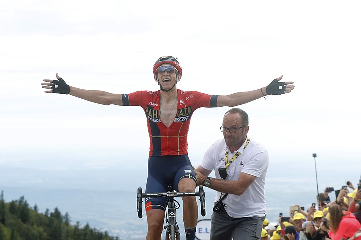Belgium’s Dylan Teuns celebrates as he crosses the finish line to win the sixth stage of the Tour de France over 160 kilometers (100 miles) with start in Mulhouse and finish in La Planche des Belles Filles, France, Thursday, July 11, 2019. (Thibault Camus/AP)