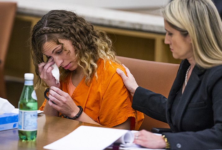 Brittany Zamora wipes away a tear as her attorney, Belen Olmedo Guerra, pats her shoulder. Zamora was sentenced to 20 years in prison by Maricopa County Superior Court Judge Sherry Stephens in Phoenix, Friday, July 12, 2019. Judge Stephens also handed down two lifetime terms of probation to the former Goodyear teacher for molesting a 13-year-old student. (Tom Tingle/Arizona Republic via AP, Pool)