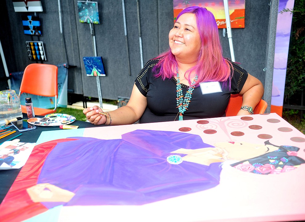 Navajo painter Jerilynn Yazzie smiles as she answers questions at the Prescott Indian Arts Market at the Sharlot Hall Museum Saturday July 13, 2019. For a short video of the event go to dCourier.com..The show continues Sunday. (Les Stukenberg/Courier)