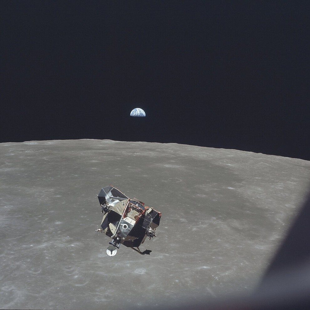 In this July 21, 1969 photo made available by NASA, the Apollo 11 Lunar Module ascent stage, carrying astronauts Neil Armstrong and Buzz Aldrin, approaches the Command and Service Modules for docking in lunar orbit. Astronaut Michael Collins remained with the CSM in lunar orbit while the other two crewmen explored the moon's surface. In the background the Earth rises above the lunar horizon. (Michael Collins/NASA via AP)