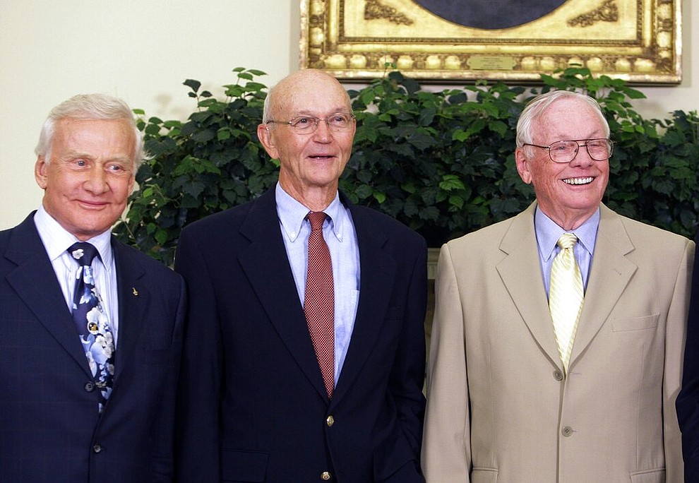 In this July 20, 2009 file photo, Apollo 11 astronauts, from left, Buzz Aldrin, Michael Collins and Neil Armstrong stand in the Oval Office at the White House in Washington, on the 40th anniversary of the mission's moon landing. (AP Photo/Alex Brandon)