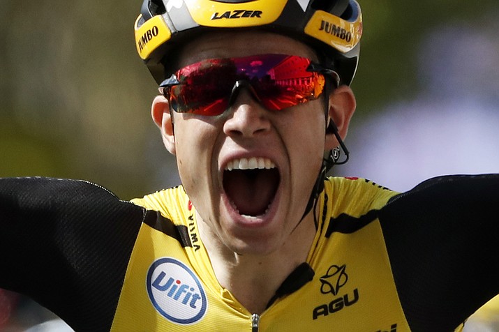 Belgium's Wout Van Aert celebrates as he crosses the finish line to win the tenth stage of the Tour de France cycling race over 217 kilometers (135 miles) with start in Saint-Flour and finish in Albi, France, Monday, July 15, 2019. (Thibault Camus/AP)