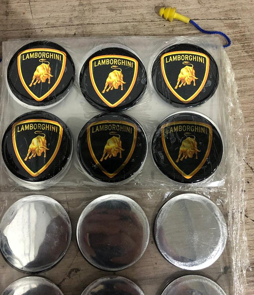 This photo released by Itajai Civil Police shows emblem badges stamped with the Lamborghini logo, inside a workshop in Itajai, Brazil.(Itajai Civil Police via AP) (Itajai Civil Police via AP)