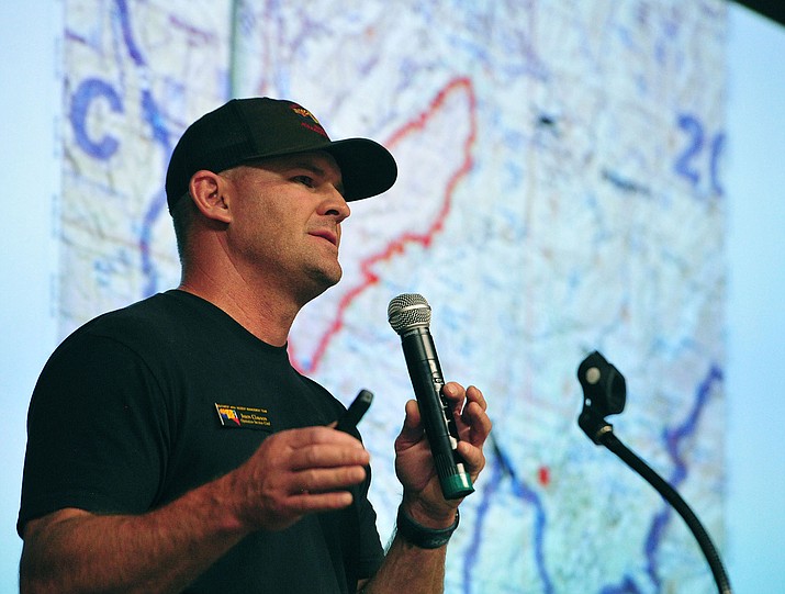 Jason Clawson of the Southwest Area Incident Management Team speaks during a Cellar Fire Community Meeting on Thursday July 18, 2019, at Glassford Hill Middle School in Prescott Valley. (Les Stukenberg/Courier)