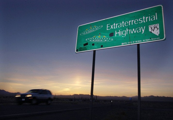 In this April 10, 2002, file photo, a vehicle moves along the Extraterrestrial Highway near Rachel, Nev., the closest town to Area 51. The U.S. Air Force has warned people against participating in an internet joke suggesting a large crowd of people "storm Area 51," the top-secret Cold War test site in the Nevada desert. (AP Photo/Laura Rauch, File)