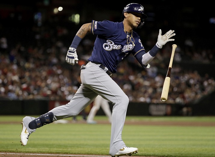 Milwaukee Brewers’ Orlando Arcia tosses his bat after hitting an RBI single against the Arizona Diamondbacks during the eighth inning of a game, Thursday, July 18, 2019, in Phoenix. (Matt York/AP)