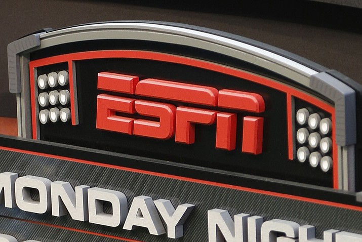 This Sept. 16, 2013, photo shows the ESPN logo prior to an NFL football game between the Cincinnati Bengals and the Pittsburgh Steelers, in Cincinnati. ESPN is reminding employees of the network's policy to avoid talking about politics after radio talk show host Dan Le Batard criticized President Donald Trump and his recent racist comments and ESPN itself on the air this week. (David Kohl/AP, File)