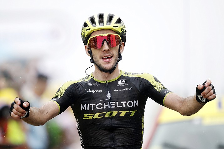 Britain's Simon Yates celebrates as he crosses the finish line to win the 15th stage of the Tour de France cycling race over 114,95 miles with start in Limoux and finish in Prat d'Albis, France, Sunday, July 21, 2019. (Christophe Ena/AP)