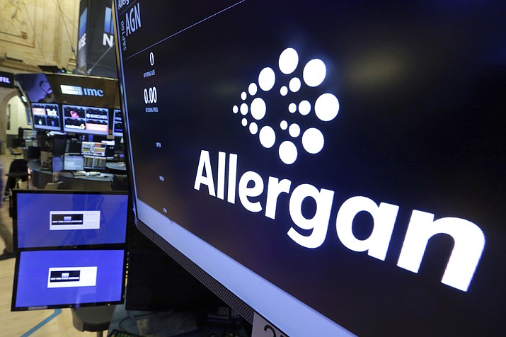 FILE - In this Monday, Nov. 23, 2015, file photo, the Allergan logo appears above a trading post on the floor of the New York Stock Exchange. On Wednesday, July 24, 2019, the medical device maker announced a worldwide recall of its Biocell breast implants which are linked to a rare form of cancer. (AP Photo/Richard Drew, File)