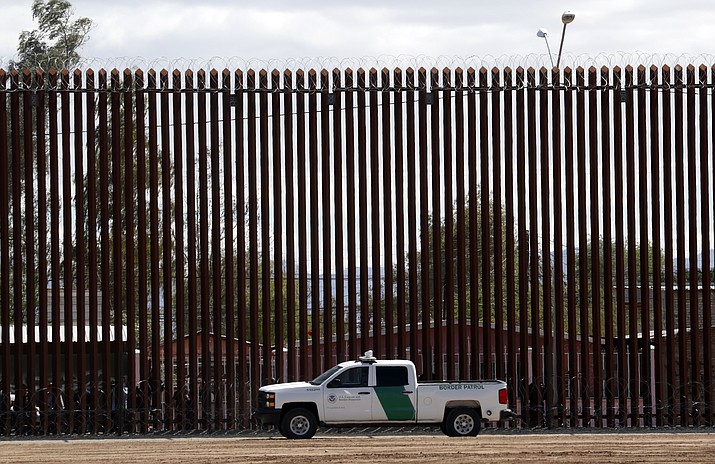 A U.S. Customs and Border Protection vehicle sits near the wall April 5, 2019, as President Donald Trump visits a new section of the border wall with Mexico in El Centro, Calif. The Supreme Court has cleared the way for the Trump administration to tap Pentagon funds to build sections of a border wall with Mexico. (Jacquelyn Martin/AP, File)