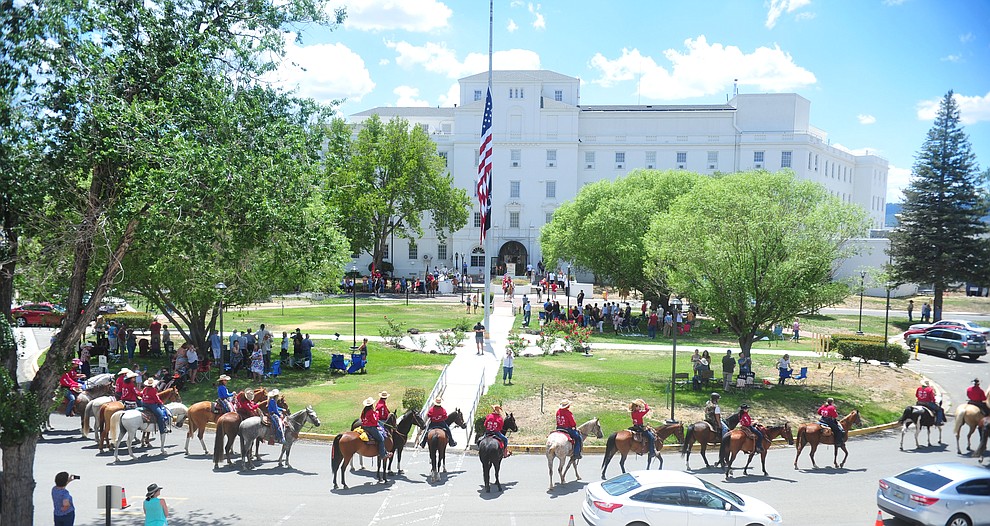 Trinity Tompkins sings the National Anthem as the Prescott Long Riders ride through the VA Hospital in Prescott Saturday July 27, 2019. (Les Stukenberg/Courier)