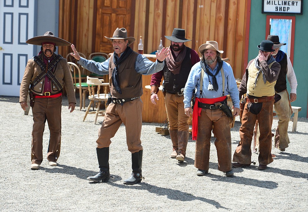 The Superstition Mountain Regulators perform a skit the Whiskey Row Shootout in downtown Prescott Saturday July 27, 2019. (Les Stukenberg/Courier)