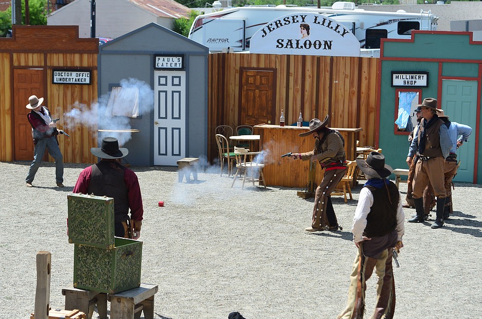 The Superstition Mountain Regulators perform a skit the Whiskey Row Shootout in downtown Prescott Saturday July 27, 2019. (Les Stukenberg/Courier)