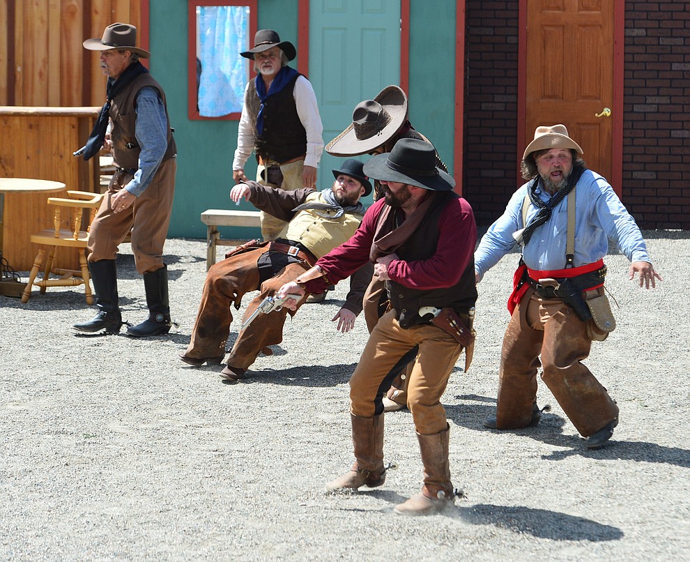 The Superstition Mountain Regulators perform a skit the Whiskey Row Shootout in downtown Prescott Saturday July 27, 2019. (Les Stukenberg/Courier)