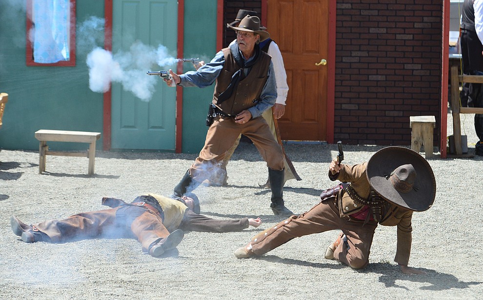 The Superstition Mountain Regulators perform a skit the Whiskey Row Shootout in downtown Prescott Saturday July 27, 2019. (Les Stukenberg/Courier)
