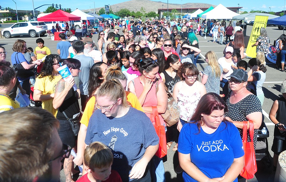 It was a long line to start as the Yavapai Food Bank gave away 1300 backpacks in the parking lot of Findlay Toyota Center Saturday July 27, 2019 in Prescott Valley. (Les Stukenberg/Courier)