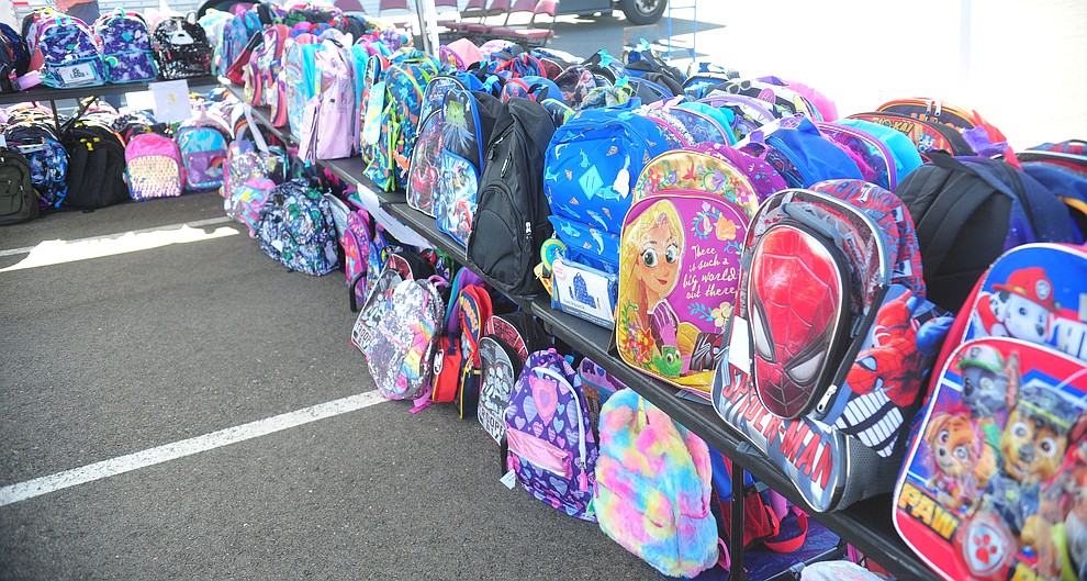 The Yavapai Food Bank gave away 1300 backpacks in the parking lot of Findlay Toyota Center Saturday July 27, 2019 in Prescott Valley. (Les Stukenberg/Courier)