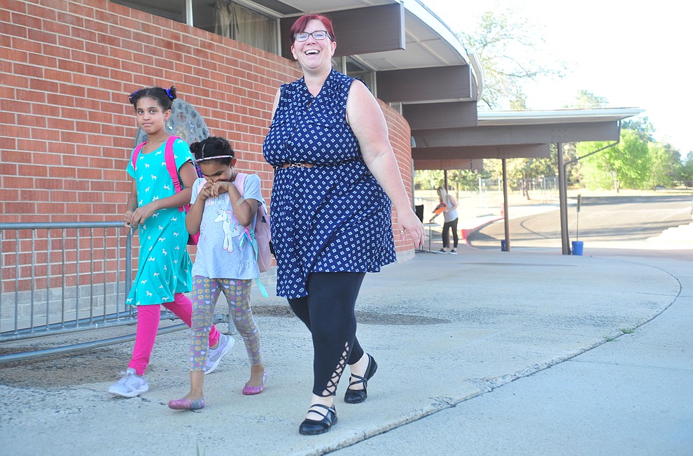 Kimberly Gregory, right, walks in with her daughters Josslyn and Chrislyn Seagraves for the first day of school at Taylor Hicks Elementary School in Prescott Thursday, August 1, 2019. (Les Stukenberg/Courier)