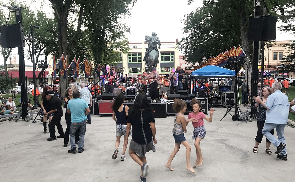 People dance as Road One South plays for the National Night Out Kickoff on the Yavapai County Courthouse plaza Friday, August 2, 2019, in downtown Prescott. (Les Stukenberg/Courier)