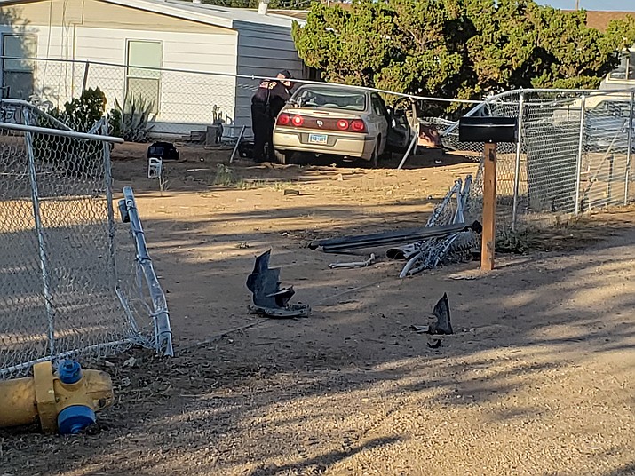 The vehicle finally came to a stop in the 3600 block of Northern Avenue after striking a fence and traveling through the property to the opposite fence line. (Photo courtesy of MCSO)