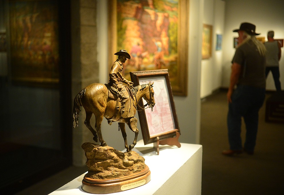 Artists Joe Netherwood, Bill Nebeker, Steve Atkinson, Shawn Cameron and Marless Fellows have artwork on display in the Yavapai College Gallery at the 32nd Annual Arizona Cowboy Poets Gathering Friday, August 9, 2019, being held at the Prescott campus of Yavapai College. The event continues Saturday with workshops from 9 a.m. to 5 p.m. and a show, tickets required, at the Performance Hall at 7 p.m. featuring Mark Munzert, Gail Steiger, Jay Snider and The Cowboy Way Trio. (Les Stukenberg/Courier)