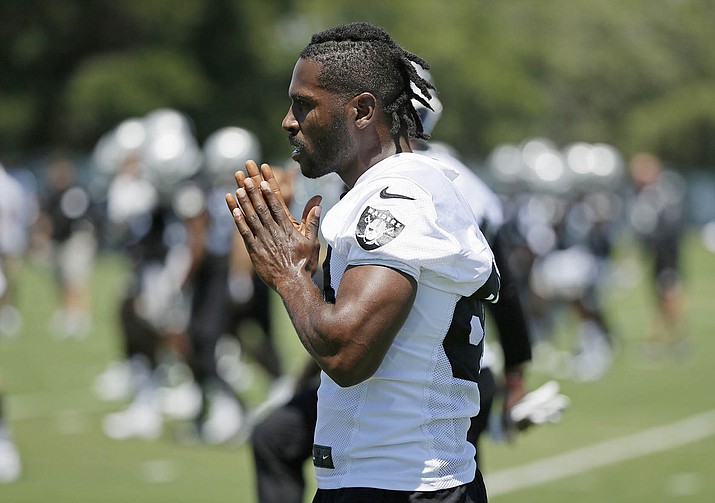 FILE - In this June 11, 2019, file photo, Oakland Raiders wide receiver Antonio Brown is shown during an NFL football minicamp in Alameda, Calif. The Raiders and their big personalities like Antonio Brown and Richie Incognito are ready to be stars on HBO’s “Hard Knocks.” (Eric Risberg/AP, File)