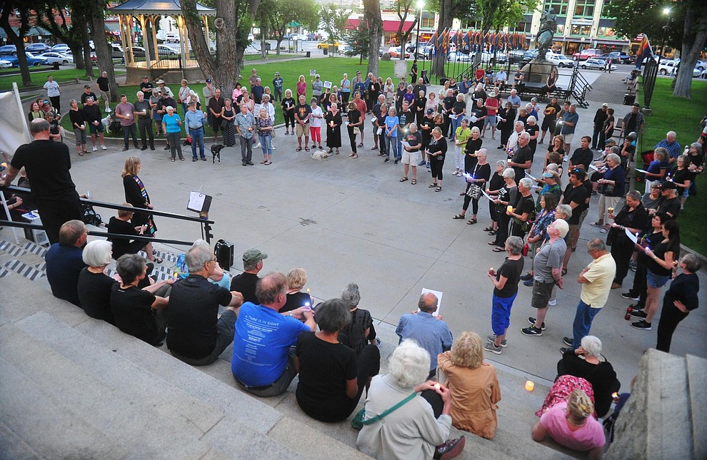 Several hundred people gather on the Yavapai County Courthouse plaza for a candlelight vigil honoring the victims of the El Paso and Dayton shootings Monday, August 12, 2019 in downtown Prescott. (Les Stukenberg/Courier)