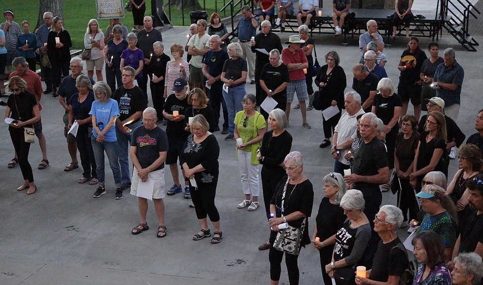 Several hundred people gather on the Yavapai County Courthouse plaza for a candlelight vigil honoring the victims of the El Paso and Dayton shootings Monday, August 12, 2019 in downtown Prescott. (Les Stukenberg/Courier)