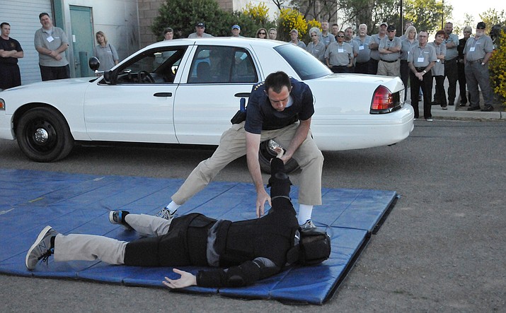 Northern Arizona Regional Training Academy (NARTA) recruits Greg Grahlmann (on top) and Wyatt Novak (on ground) perform a scenario during the spring 2017 Citizens’ Police Academy. (Max Efrein/Courier)