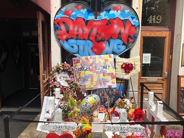 A makeshift memorial sits outside Ned Peppers nightclub in the Oregon District entertainment neighborhood where on Aug. 4 a gunman killed nine people, on Wednesday, Aug. 14, 2019, in Dayton Ohio(AP Photo/Dan Sewell)