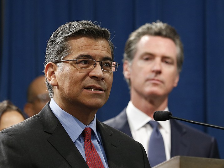 California Attorney General Xavier Becerra, left, accompanied by Gov. Gavin Newsom, discusses the lawsuit the state has filed against the Trump administration's new rules blocking green cards for many immigrants who receive government assistance, during a news conference in Sacramento, Calif., Friday, Aug. 16, 2019. California, three other states and the District of Columbia filed the suit Friday against some of the administration's most aggressive moves to restrict legal immigration that are supposed to take effect in October. (AP Photo/Rich Pedroncelli)