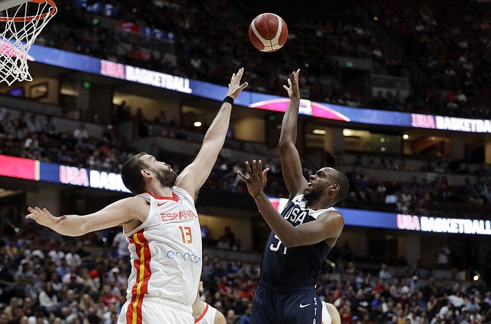 United States’ Khris Middleton, right, shoots over Spain’s Marc Gasol during an exhibition game Friday, Aug. 16, 2019, in Anaheim, Calif. (Marcio Jose Sanchez/AP)