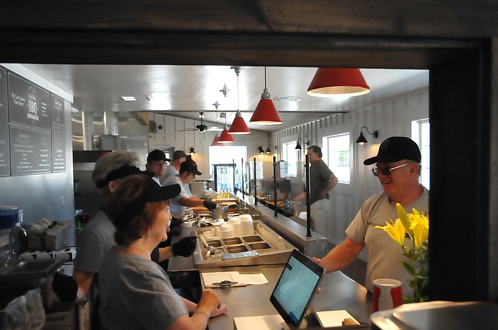 The dining room inside Lucy Dee’s is operated by nine employees. The restaurant was completely renovated by Zip Lucidi and several contractors. Lucy Dee’s BBQ serves handcut meats and side dishes with its dinners. (Doug Cook/Courier)