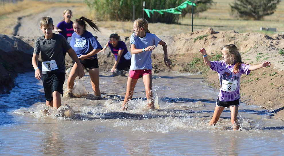 Over 300 people competed in the fourth annual Chino Valley Mud Run at Old Home Manor in Chino Valley Saturday, August 17, 2019. The 5 kilometer race had 22 obstacles that tested each racers endurance and fitness. (Les Stukenberg/Courier)