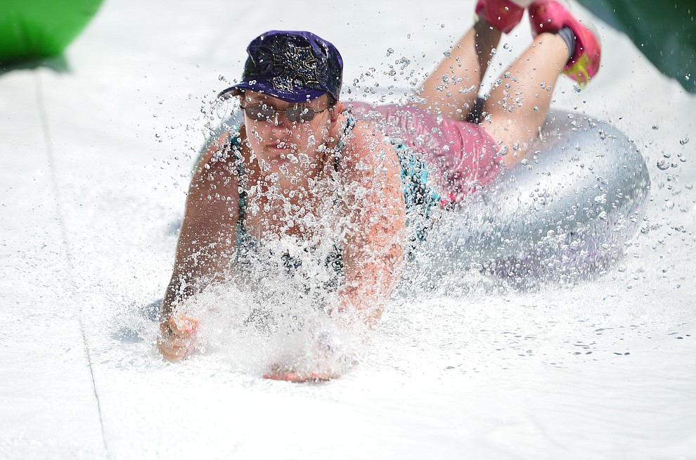 Brianna Klassen from Chino Valley at the annual Monsoon Festival with the water slide that stetches most of the length of Union Street Saturday, August 17, 2019, in downtown Prescott. (Les Stukenberg/Courier)