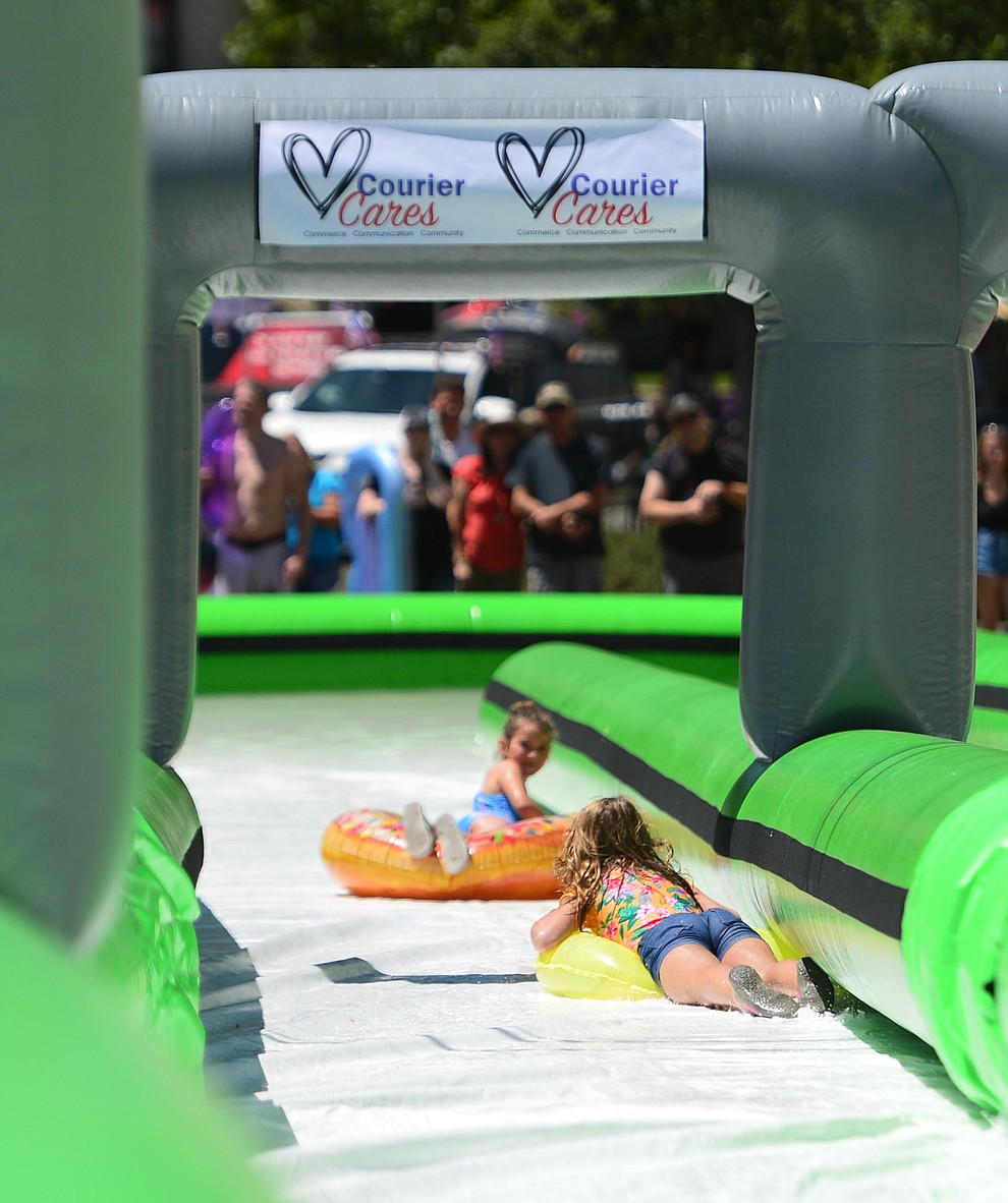 The annual Monsoon Festival with the water slide that stetches most of the length of Union Street Saturday, August 17, 2019, in downtown Prescott. (Les Stukenberg/Courier)