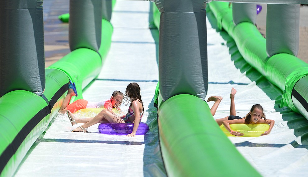 The annual Monsoon Festival with the water slide that stetches most of the length of Union Street Saturday, August 17, 2019, in downtown Prescott. (Les Stukenberg/Courier)