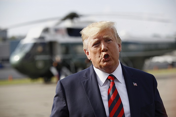 President Donald Trump speaks with reporters before boarding Air Force One at Morristown Municipal Airport in Morristown, N.J., Sunday, Aug. 18, 2019. (Patrick Semansky/AP)