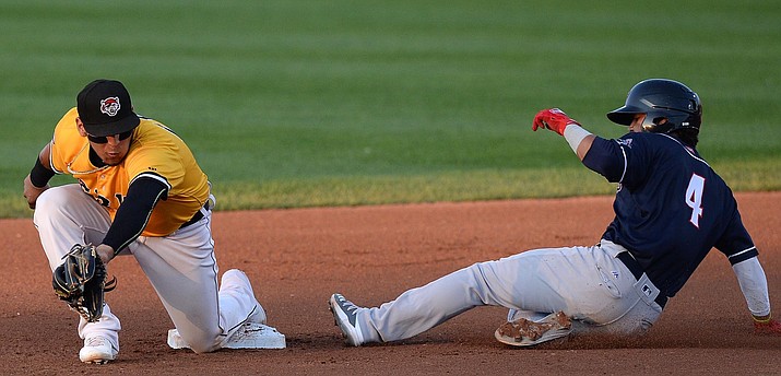 New Hampshire Fisher Cats' Santiago Espinal steals second base ahead of the tag by Erie SeaWolves shortstop Isaac Paredes during a minor league Double-A baseball game Friday, Aug. 2, 2019, in Erie, Pa. (Jack Hanrahan/Erie Times-News via AP) A federal appeals court has given a key victory to players on minor league teams the right to sue to be paid the minimum wage while they’re in spring training in Arizona.