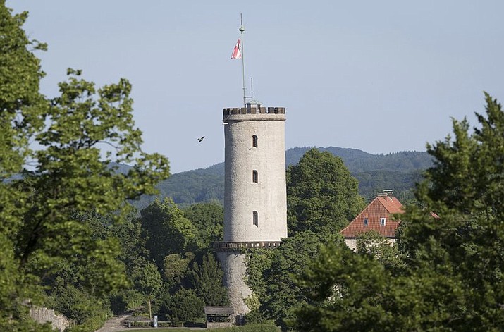 In this May 27, 2017 file photo, a castle is pictured in Bielefeld, Germany. The Germany city that’s been the subject of a long-running online conspiracy theory claiming it doesn’t really exist is offering big bucks to whoever proves that’s true. City officials in Bielefeld said Wednesday they’ll give 1 million euros ($1.1 million) to the person who delivers solid proof of its non-existence. (Friso Gentsch/dpa via AP)