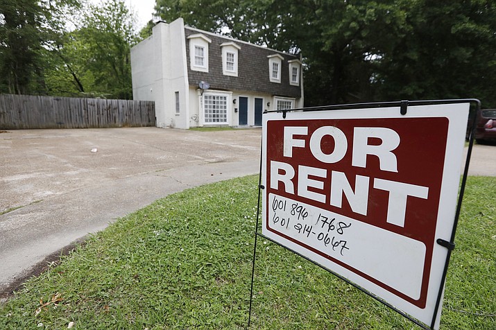 In this April 23, 2018, file photo a for rent sign denotes the availability of an existing home. Millennials are delaying homeownership and staying in leased housing longer than previous generations, studies show. (Rogelio V. Solis/AP, File)