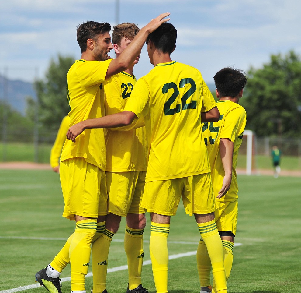 Yavapai's Manuel Quiroz (22) gets congratulated on the first goal as the Roughriders host South Mountain Community College Thursday, August 22, 2019, in Prescott Valley. (Les Stukenberg/Courier)