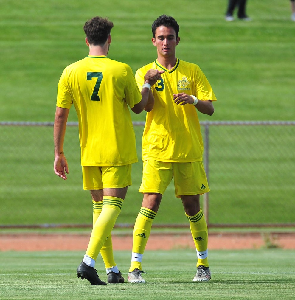 Yavapai's Brandon Fischer congratulates Tucker Fenton on his goal as the Roughriders host South Mountain Community College Thursday, August 22, 2019, in Prescott Valley. (Les Stukenberg/Courier)